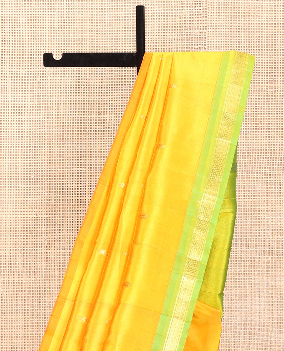Yellow Kanchipuram Silk Saree, Subtly Sparkled with Zari Buttas, a Contrast One-Sided Border of Banaras, and Mayil Kann Design, Zari-Woven Pallu, and No Blouse