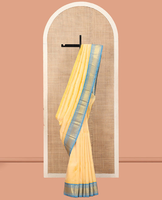 Pale Yellow Kanchipuram Silk Saree, Sparsely Woven with Zari Buttas, a Contrast One-Sided Border of Panner Sombu, Banaras, and Jaal Designs, a Zari Design Pallu, and No Blouse