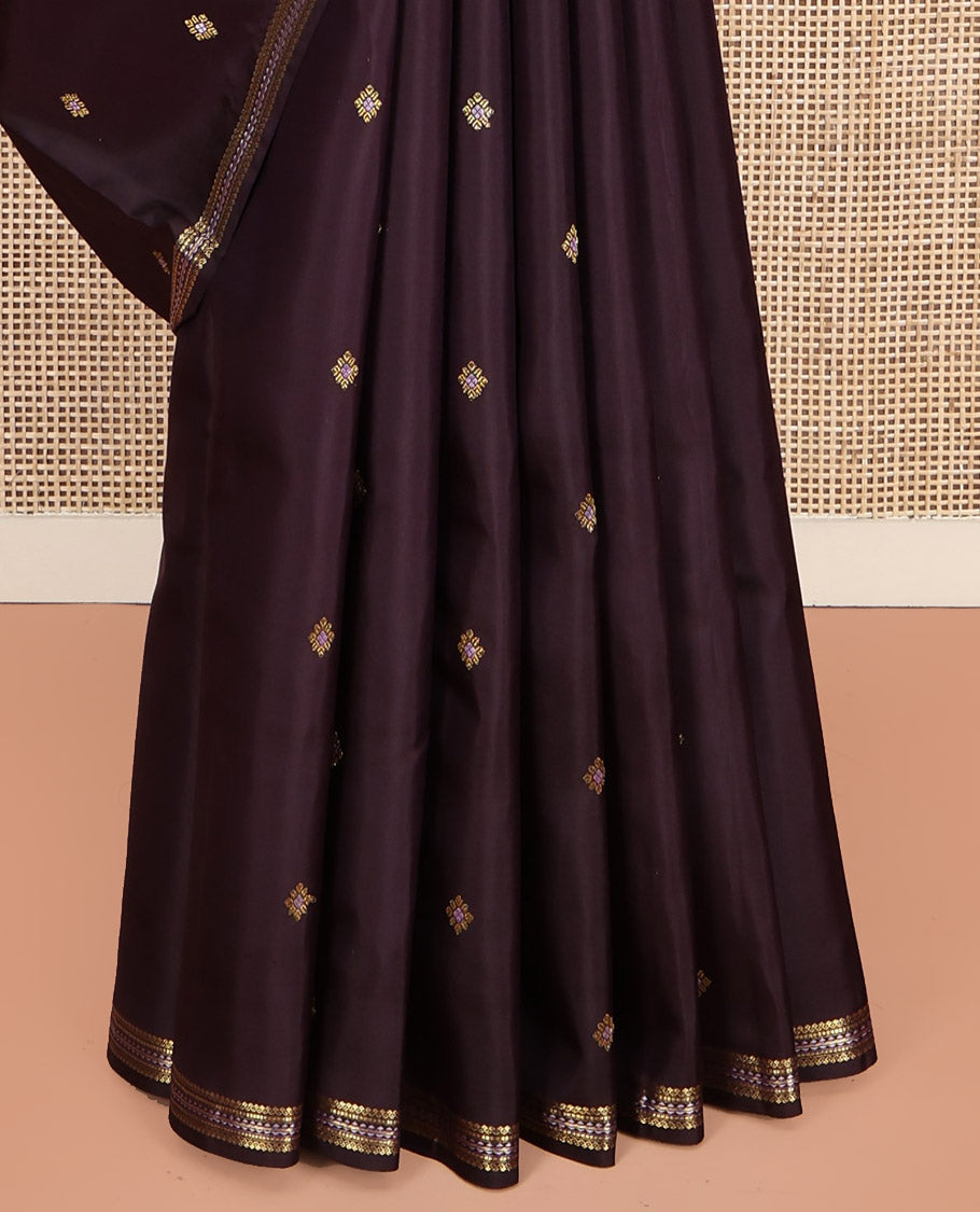 Brown Kanchipuram Silk Saree, Delicately Woven with Zari Buttas All Over Its Body, Highlighted by a Zari Border of Salngai, Muthu, and Rekku Designs, Pallu of Intricate Designs, and Paired with a Matching Blouse