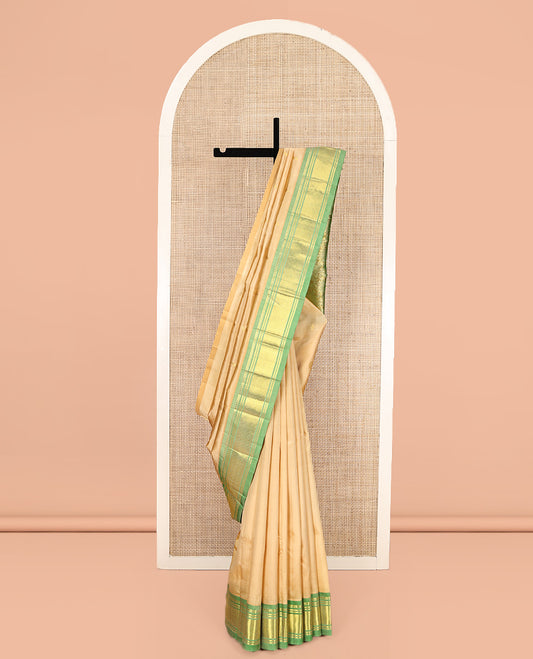 Sandal Kanchipuram Silk Saree, Sparsely Sparkled with Zari Buttas, Complemented by a Contrast One-Sided Border of Panner Sombu, Banaras, and Jaal, Floral Design Pallu, and No Blouse