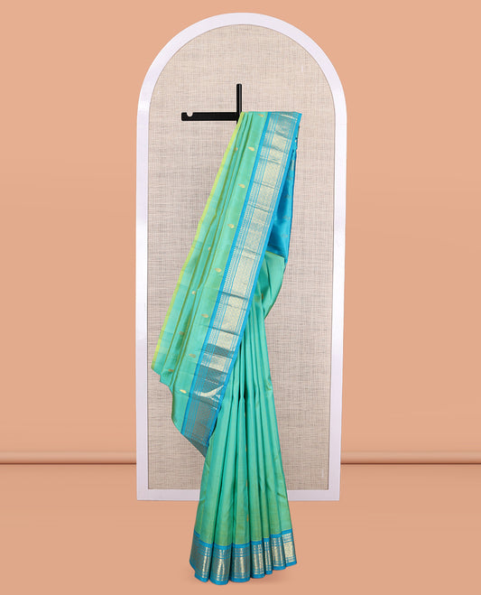 Turquoise Kanchipuram Silk Saree, Woven with Zari Buttas, a Contrast One-Sided Border of Panner Sombu, Banaras, Muthu, and Jaal Designs, Zari Design Pallu, and No Blouse
