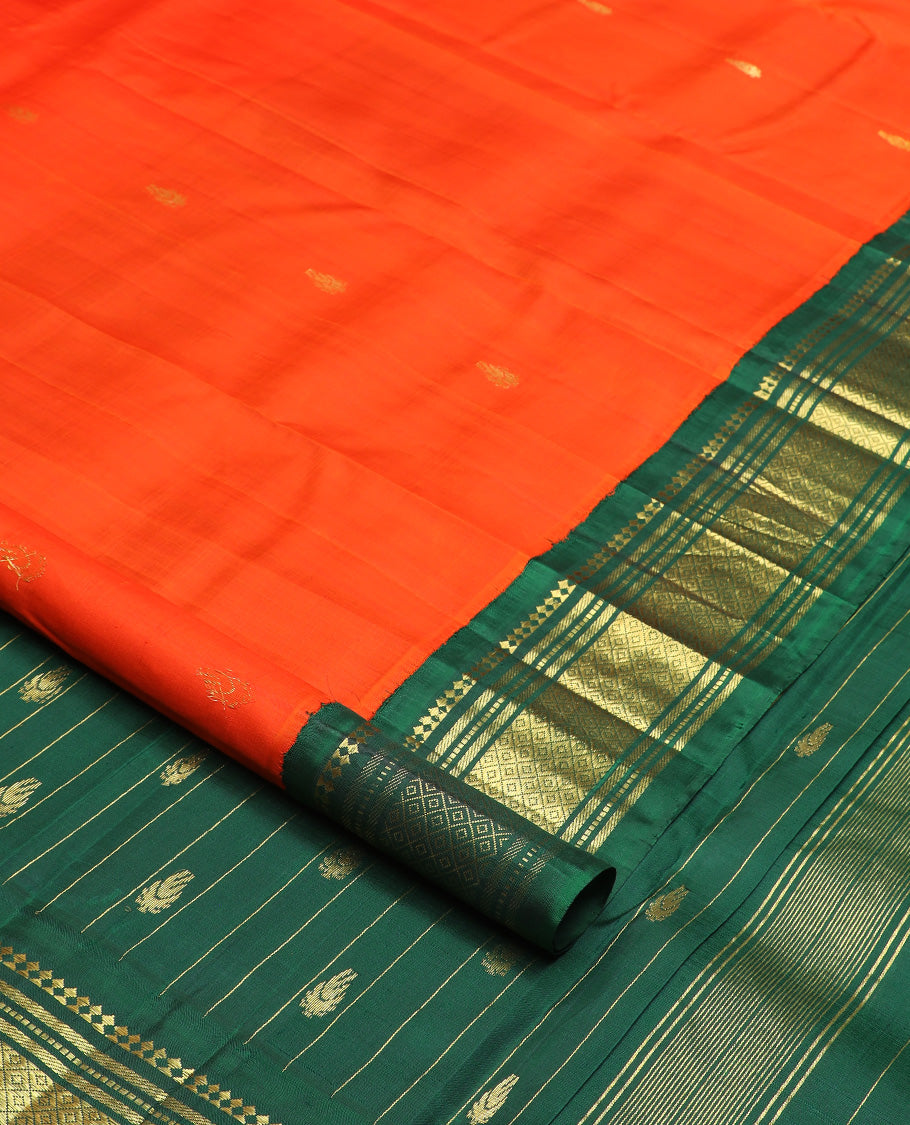 Orange zari buttas Kanchipuram silk saree, contrast one-sided korvai border of paneer sombu, banaras, muthu, and mayil kann, and zari design pallu