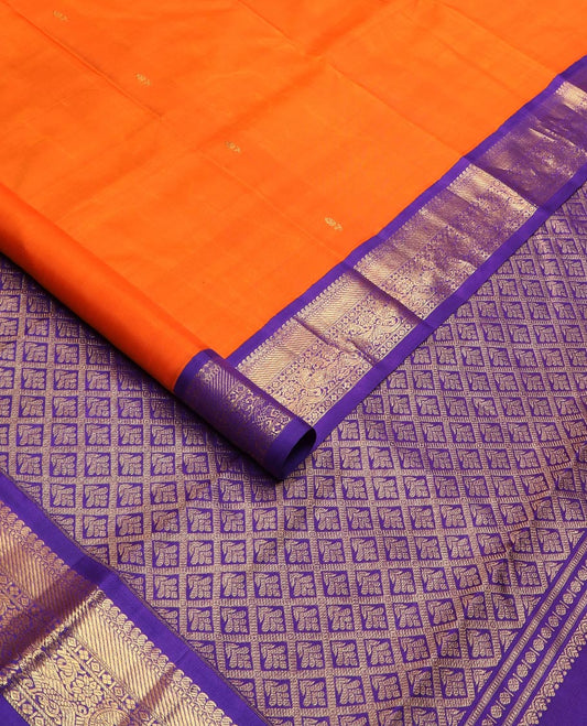 Orange zari buttas Kanchipuram silk saree, contrast korvai border of manga mokku, muthu, zari stripes, and kili motifs, and jaal pallu