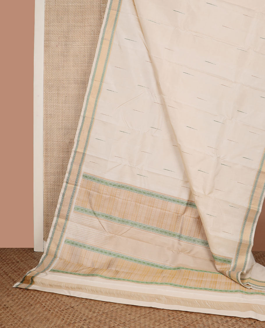 Cream malli mokku Kanchipuram silk saree, self-border of thilakam mokku, rudraksham, and mayil kann, and pallu of thilakam mokku, chakram, seppu rekku, and geometric patterns
