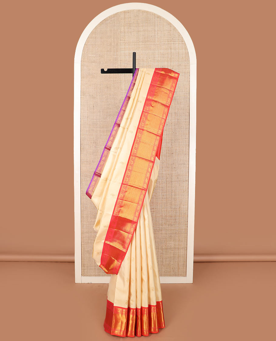 Cream manga buttas Kanchipuram silk saree, contrast ganga jamuna border of thilakam mokku, muthu, kuthirai,  and kodi mayil and yaanai designs, and jaal pallu