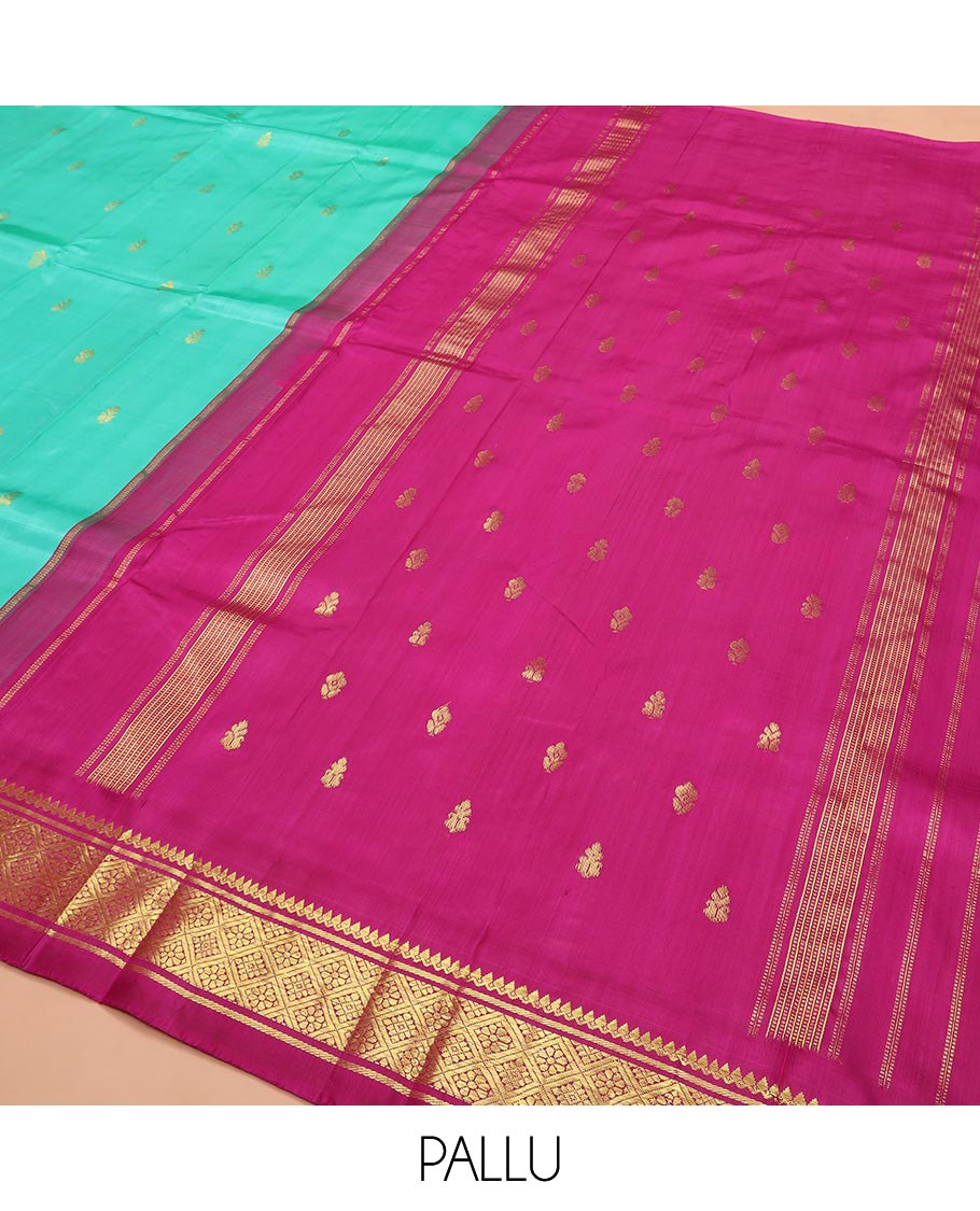 Turquoise Kanchipuram Silk Saree Bedecked with Zari Buttas All Over Its Body, Complemented by a Contrast One-Sided Korvai Border of Thilakam Mokku, Banaras, and Jaal Designs, Pallu of Zari Designs, and Comes Without a Blouse