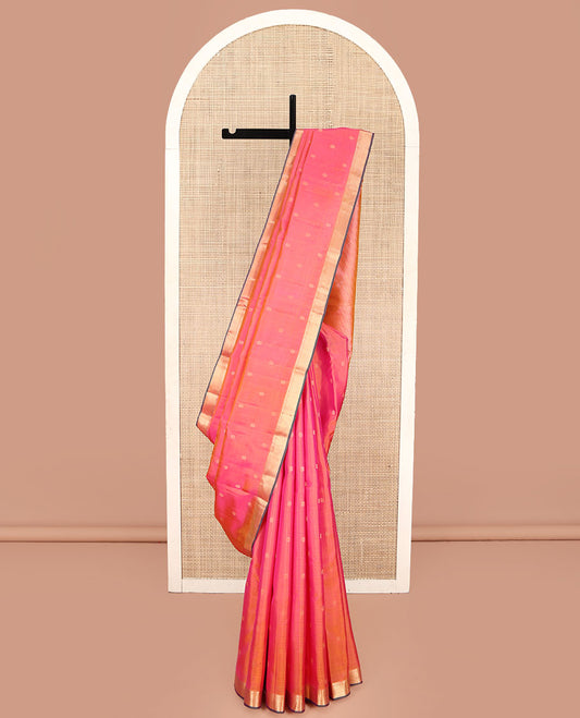 Pink Kanchipuram Silk Saree, Subtly Sparkled with Zari Buttas and Vazhaipoo Stripes All Over Its Body, Highlighted by a Zari Border of Rekku, Banaras, Neli, and Mayil Kann Designs, Intricately Designed Pallu, and Paired with a Matching Blouse