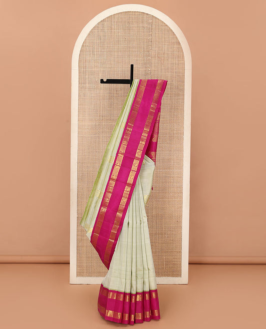 Pale green zari buttas Kanchipuram silk saree, contrast one-sided korvai rettai pettu border of rekku,mayil, manga, and diamond, and pallu of manga, and vanki