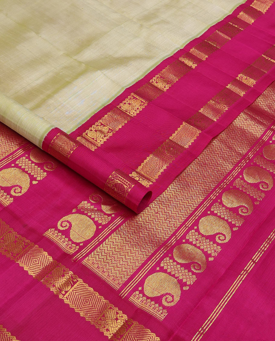 Pale green zari buttas Kanchipuram silk saree, contrast one-sided korvai rettai pettu border of rekku,mayil, manga, and diamond, and pallu of manga, and vanki