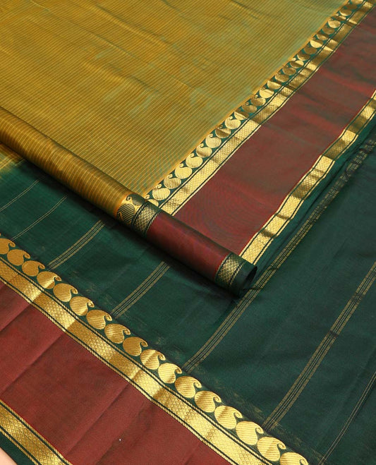 Green striped Kanchipuram silk saree, contrast rettai pettu border of manga, neli, and diamond designs, and striped pallu