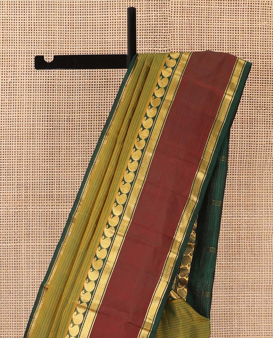 Green striped Kanchipuram silk saree, contrast rettai pettu border of manga, neli, and diamond designs, and striped pallu