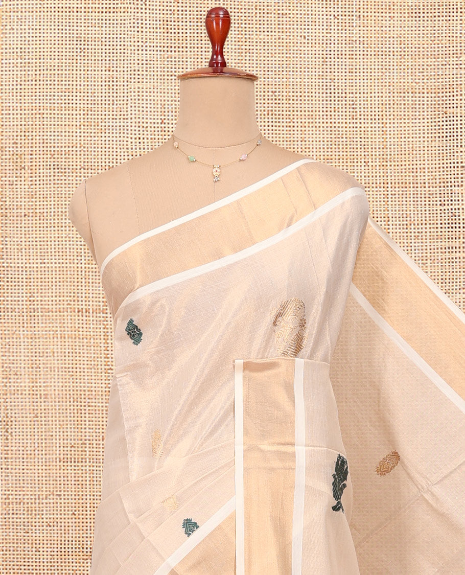 Cream Kerala Cotton Saree, Decorated with Zari Buttas All Over Its Body, a Zari Bavanji Border, Pallu of Intricate Designs, and Paired with a Matching Blouse