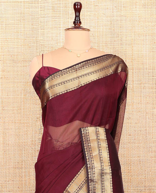 Maroon Plain Maheshwari Cotton Saree, Showcasing Traditional Zari Designs Woven Border, Pallu Steeped with Zari Stripes, and Paired with a Matching Blouse