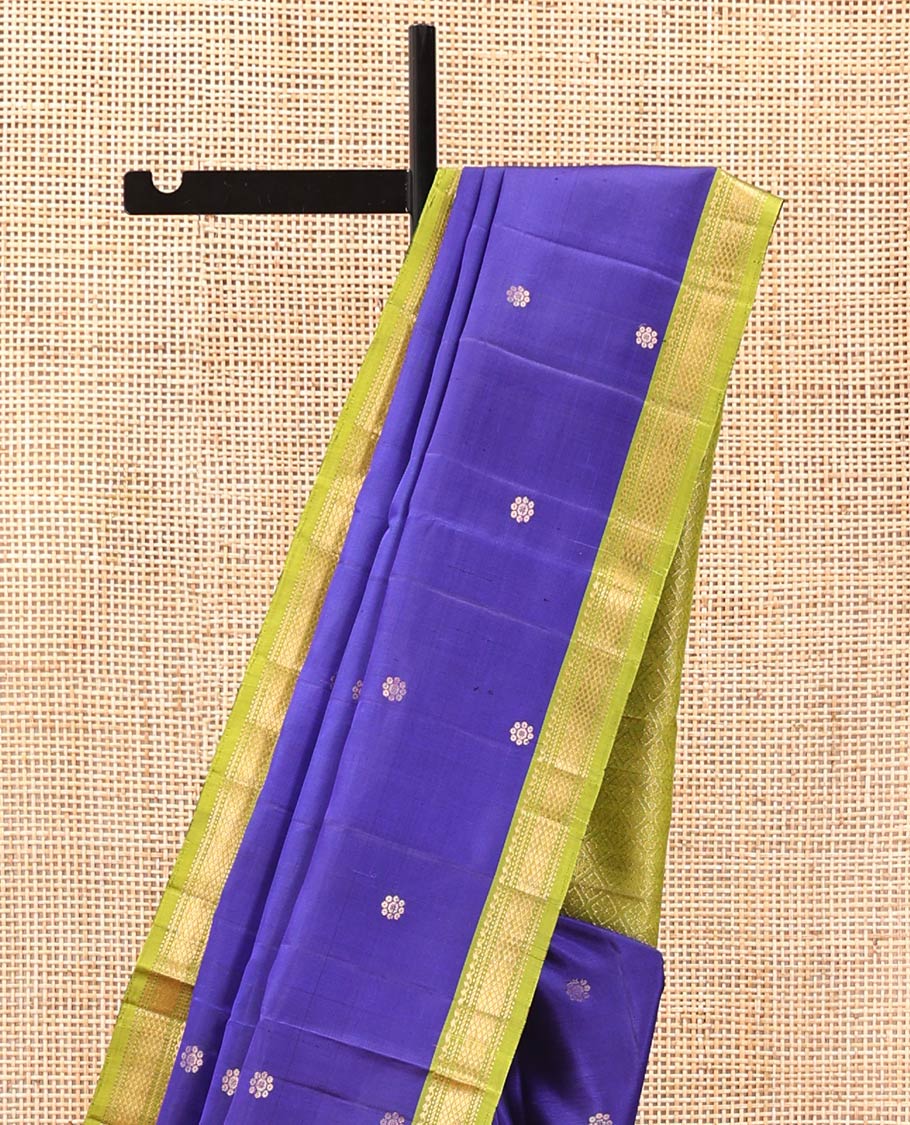 Blue Mayuri Soft Silk Saree, Spotlighted with Zari Buttas All Over Its Body, Complemented by Contrast Border of Salngai, Muthu, Banaras, and Kuyil Kann Designs, Grand Jaal Pallu and Paired with a Contrast Blouse