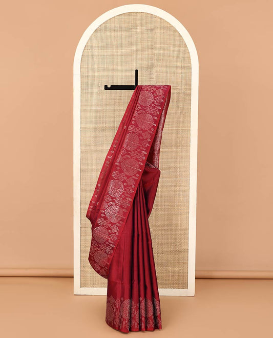 Red zari buttas soft silk saree, zari border of pine tree designs, and pallu of intricate designs