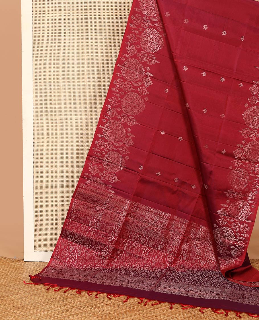 Red zari buttas soft silk saree, zari border of pine tree designs, and pallu of intricate designs
