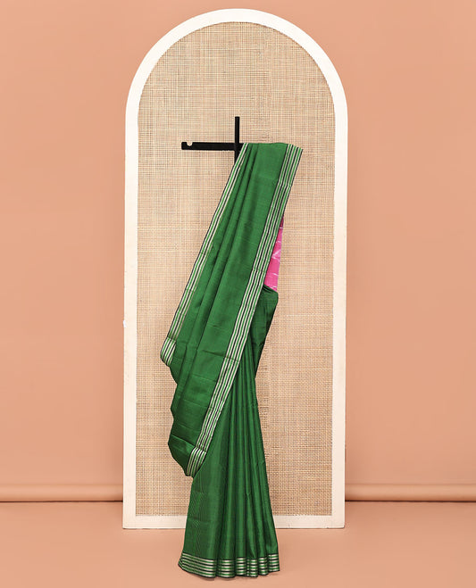 Green and Black Mayuri Soft Silk Saree, Subtly Sparkled with Kasa-Kasa Checks All Over Its Body, Highlighted by Zari Striped Border, Delicately Woven Pallu of Ikkat Texture, and Paired with a Contrast Blouse