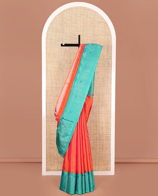 Orange Mayuri Soft Silk Saree, Elevated with Buttas All Over Its Body, Complemented by a Contrast Border of Jaal Designs, Grand Pallu of Jaal Designs, and Paired with a Contrast Blouse