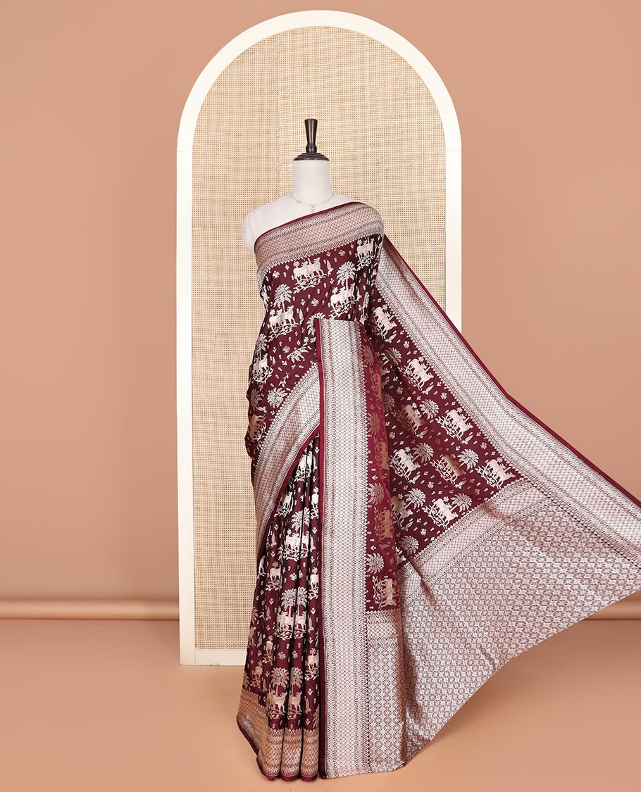 Maroon zari buttas and Pichwai cow buttas mushru silk saree, traditional design border, and zari-rich jaal pallu