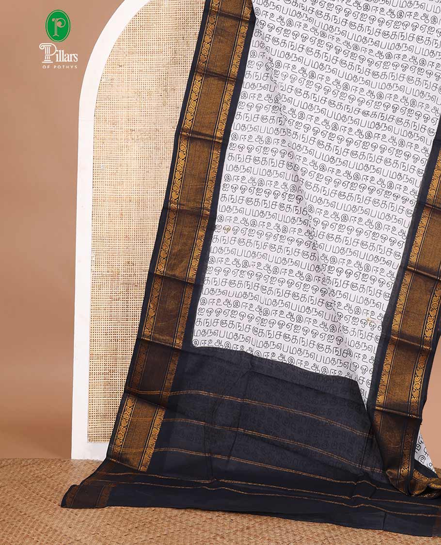 White with black tamil letters printed sungudi cotton saree with contrast jacquard border & seer pallu along with plain blouse