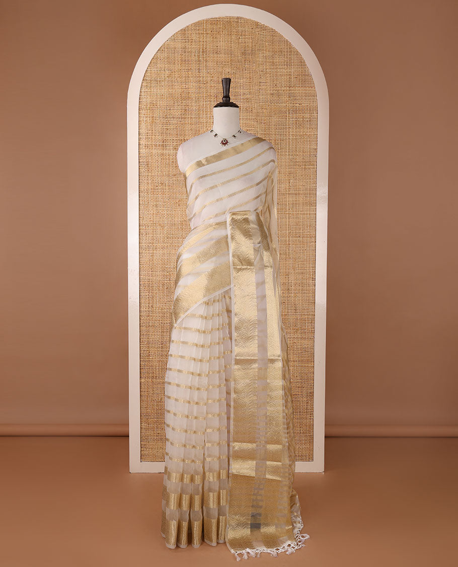 Half-white veldhari zari design semi-organza saree, gold zari floral creeper border, zari design pallu & blouse