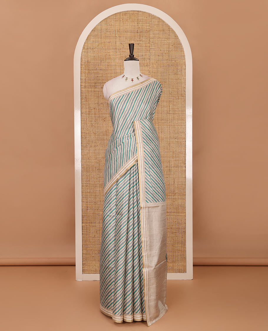 Peacock green lehariya-style striped semi-tussar saree, contrast resham thread triangle motifs border, diamond printed pallu & contrast printed blouse