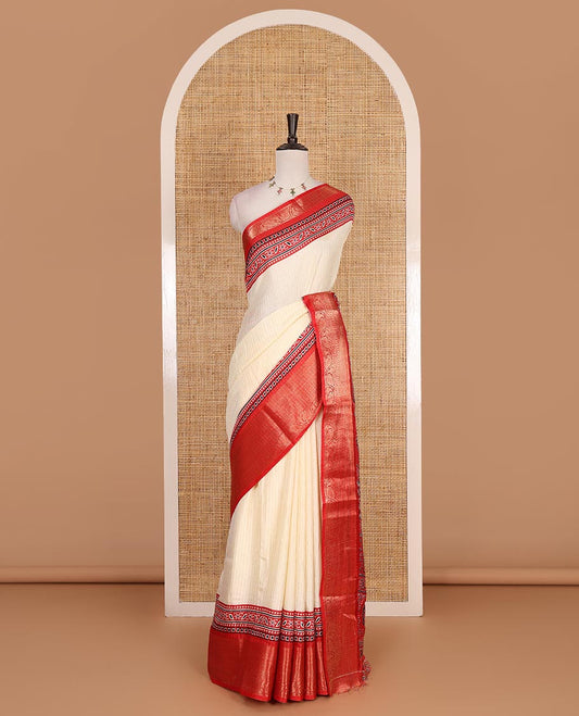 Cream-red zari striped dola silk saree, contrast traditional zari border of leaf creeper, Ajrakh printed pallu, and Ajrakh printed blouse