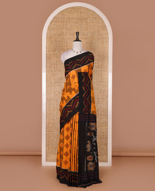 Mustard ikkat weaving ikkat cotton saree, contrast chevron design border, floral ikkat design pallu, and contrast plain blouse