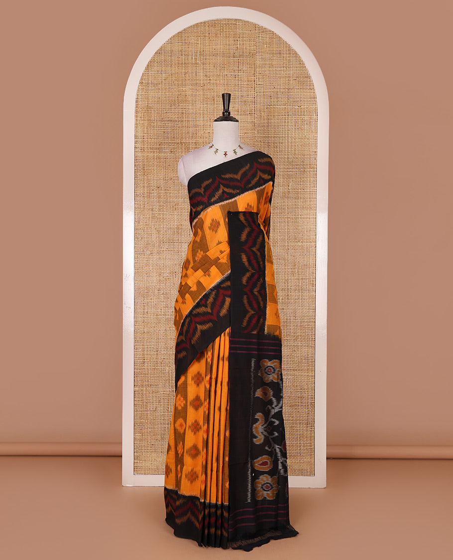 Mustard ikkat weaving ikkat cotton saree, contrast chevron design border, floral ikkat design pallu, and contrast plain blouse