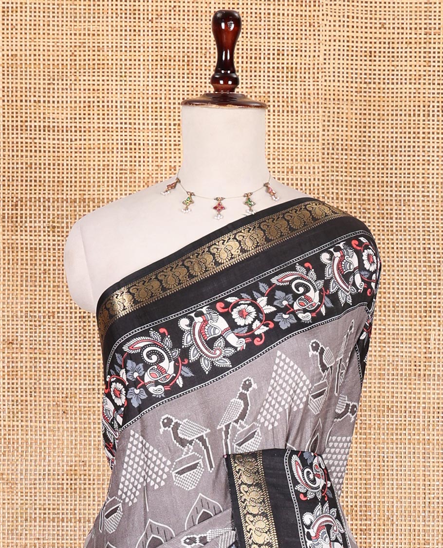 Grey pochampally ikkat parrot motifs printed dola silk saree, contrast border of kalamkari printed with zari work, kalamkari peacock printed pallu, and contrast zari design blouse