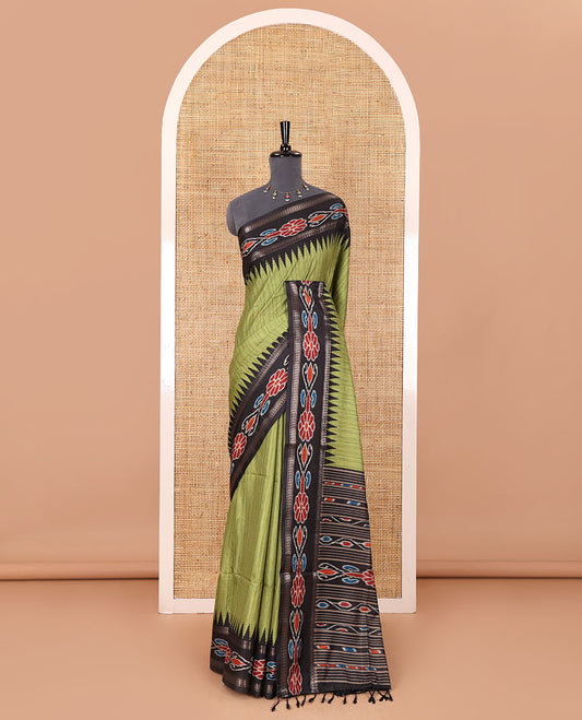 Olive green plain Katan silk saree, contrast temple ikkat floral printed border, ikkat floral printed pallu, and ikkat printed blouse