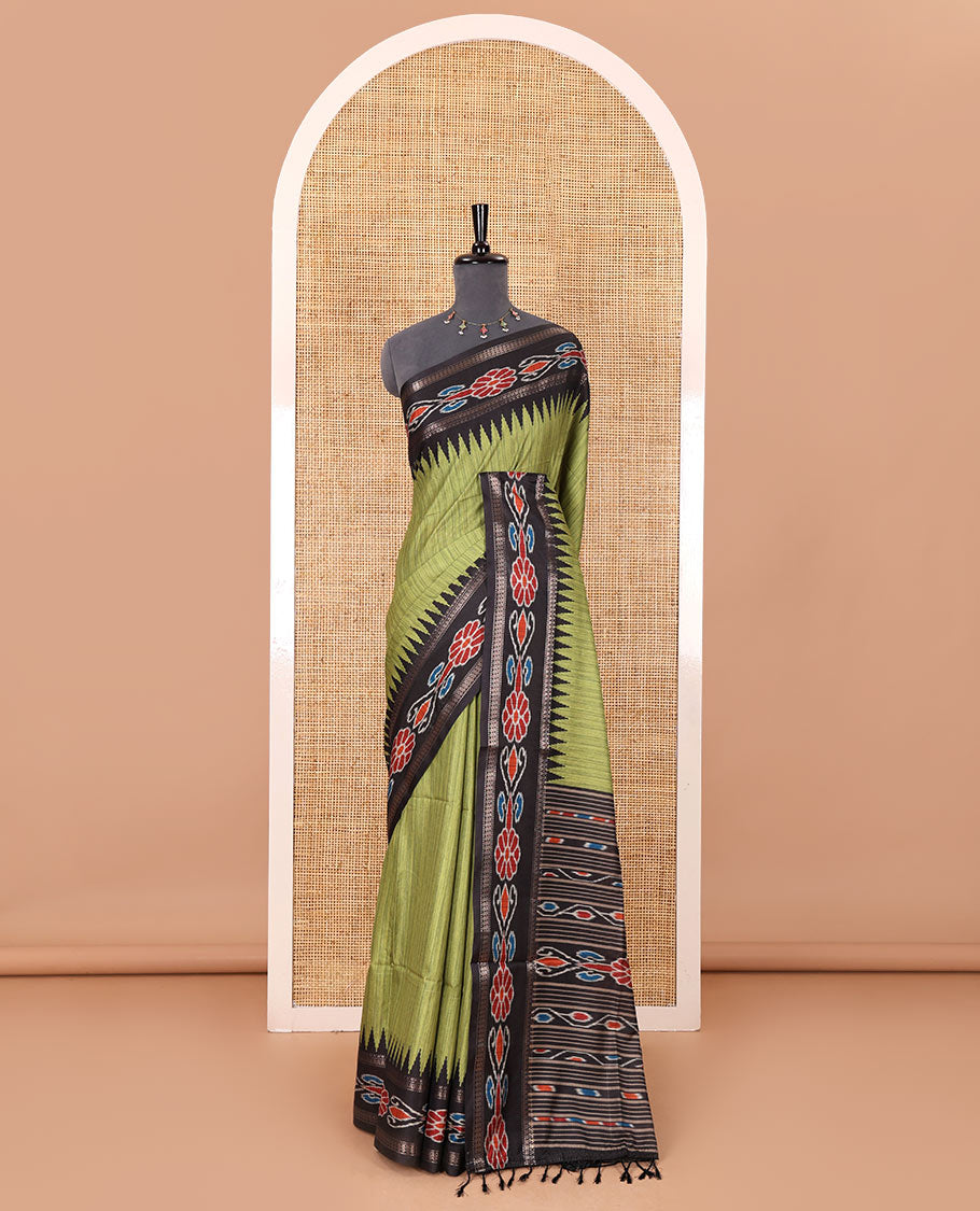 Olive green plain Katan silk saree, contrast temple ikkat floral printed border, ikkat floral printed pallu, and ikkat printed blouse