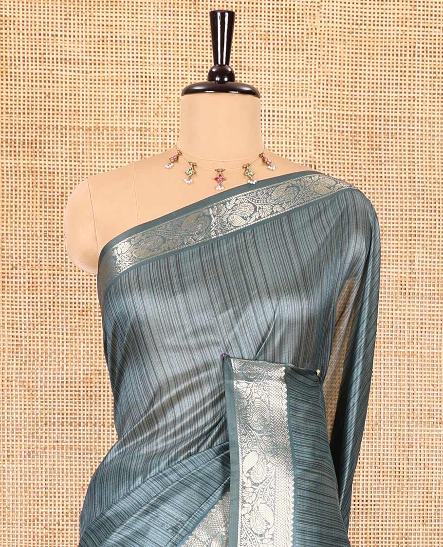 Blue striped semi-tussar saree, traditional zari border of floral creeper designs, contrast pallu of Pichwai cow print, and contrast Pichwai cow printed blouse