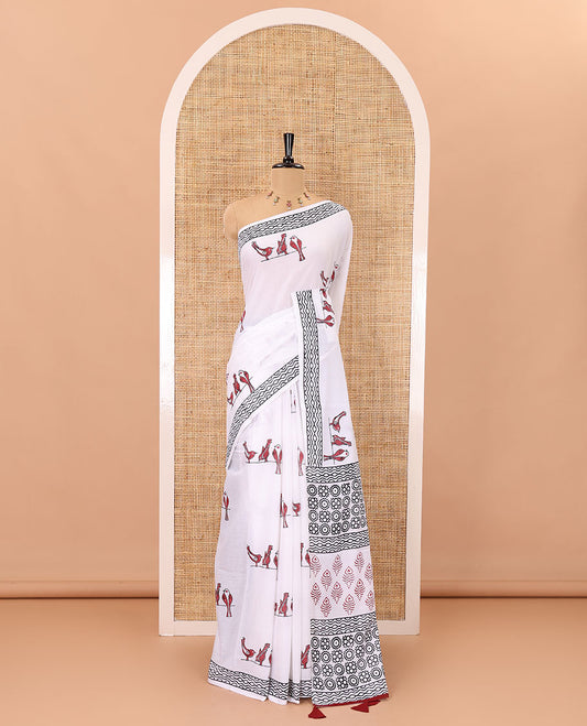 White sparrow motifs hand block printed soft mul cotton, block printed geometric border, intricate motifs printed pallu, and a contrast plain blouse