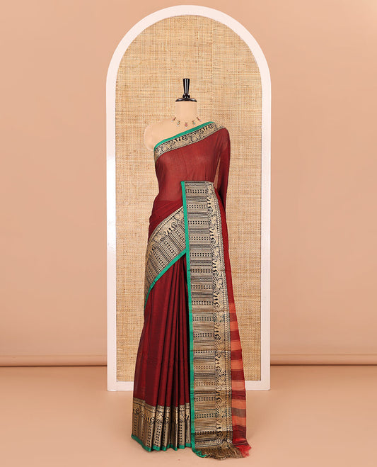 Maroon plain mercerised cotton saree, contrast traditional motifs thread woven border, striped pallu, and a matching blouse