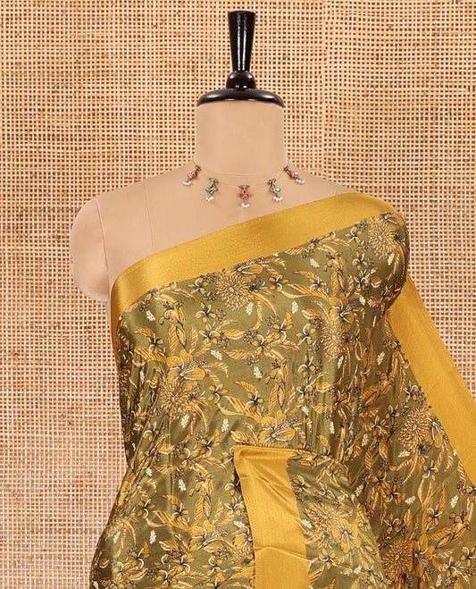 Green floral style printed Turkey crepe saree, contrast plain border, geometric printed pallu, and a contrast polka dotted blouse