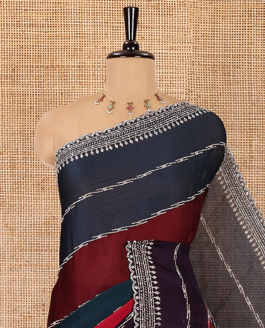 Multi-color fendy Swarovski stone work satin saree, scallop border of geometric motifs in Swarovski stone work, and a Swarovski stone work blouse
