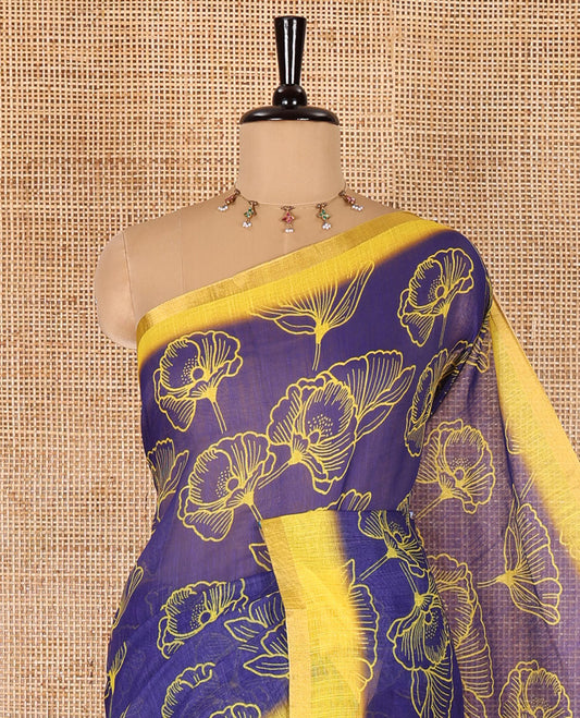 Royal blue floral printed linen cotton saree, contrast piping border, kalamkari floral and peacock printed pallu, and a contrast floral vine printed blouse