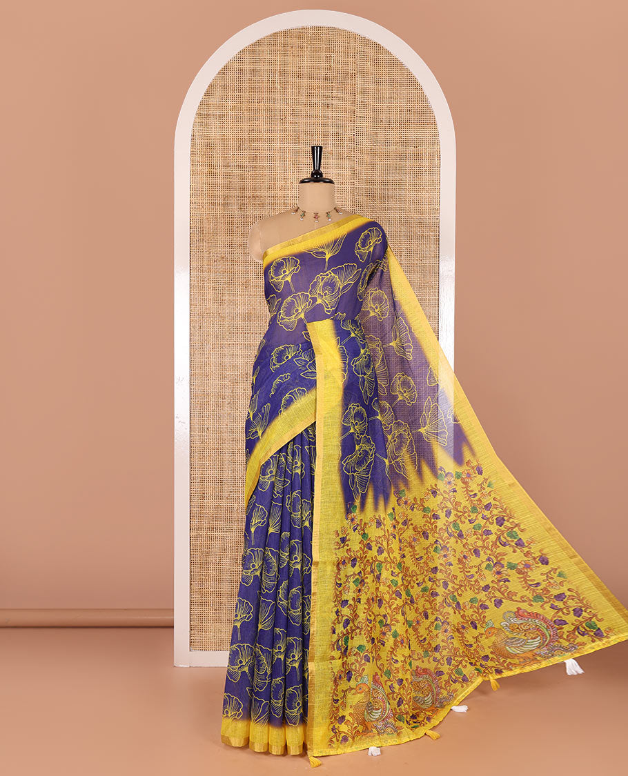 Royal blue floral printed linen cotton saree, contrast piping border, kalamkari floral and peacock printed pallu, and a contrast floral vine printed blouse