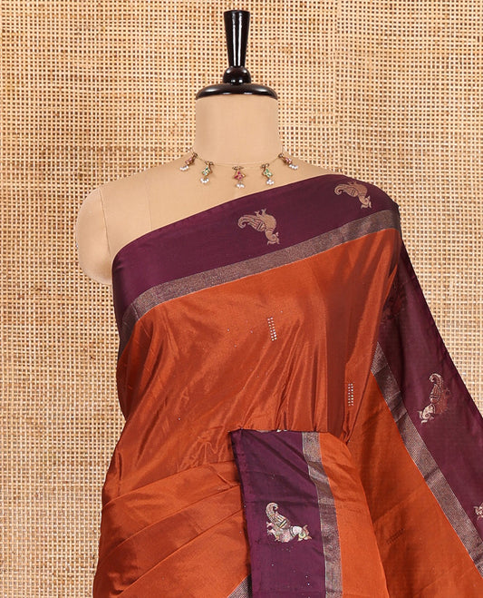 Rust orange dobby-style zari buttas semi-soft silk saree, contrast peacock zari border, zari design pallu, and a plain blouse
