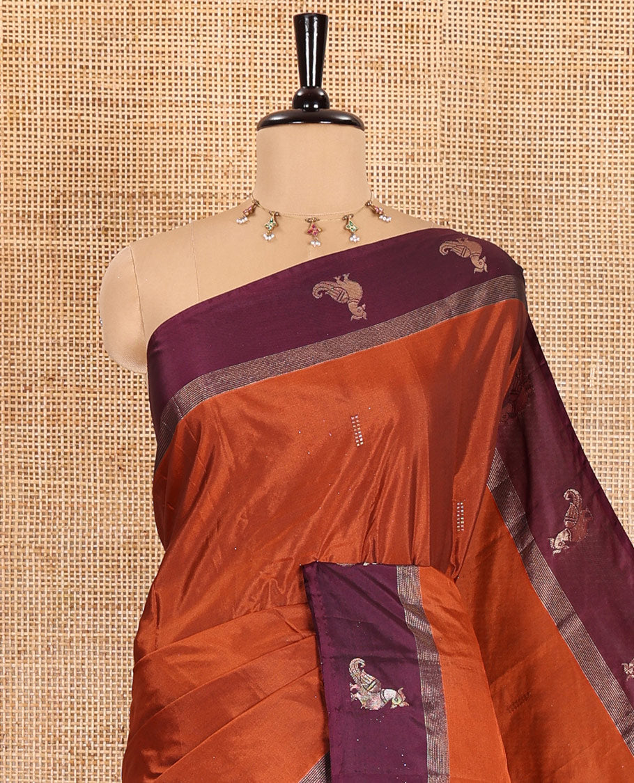 Rust orange dobby-style zari buttas semi-soft silk saree, contrast peacock zari border, zari design pallu, and a plain blouse