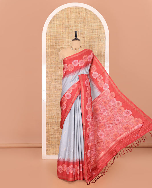Grey floral buttas katan silk saree, contrast floral motifs border, pallu adorned with floral designs, and a contrast lotus flower printed blouse