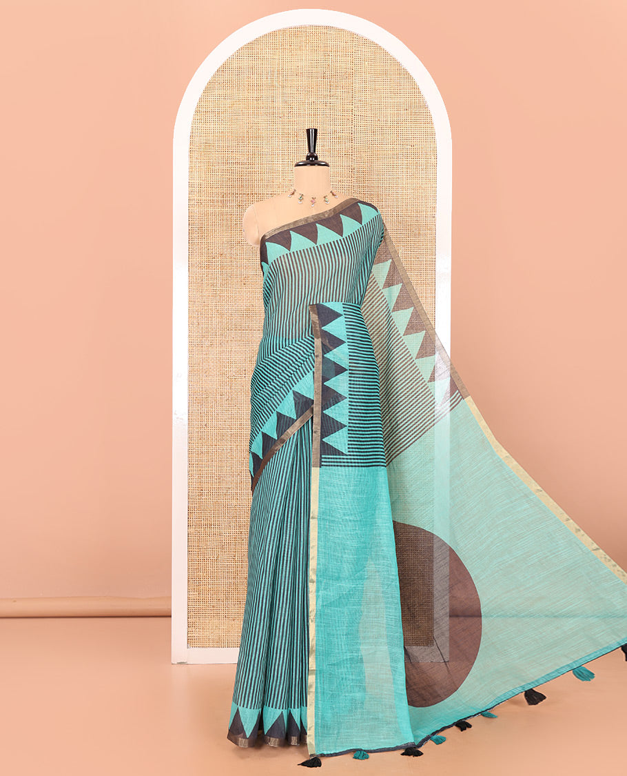 Green vertical stripes printed linen cotton saree, a temple-printed border, big polka dot printed pallu, and a printed blouse