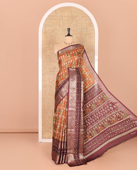 Brown Dola Silk Saree Enlivened with Floral Prints All Over the Body, Complemented by a Contrast Border Featuring Zari and Ikkat Designs, with a Pallu Decked in Ikkat and Floral Prints, Paired with a Contrast Blouse
