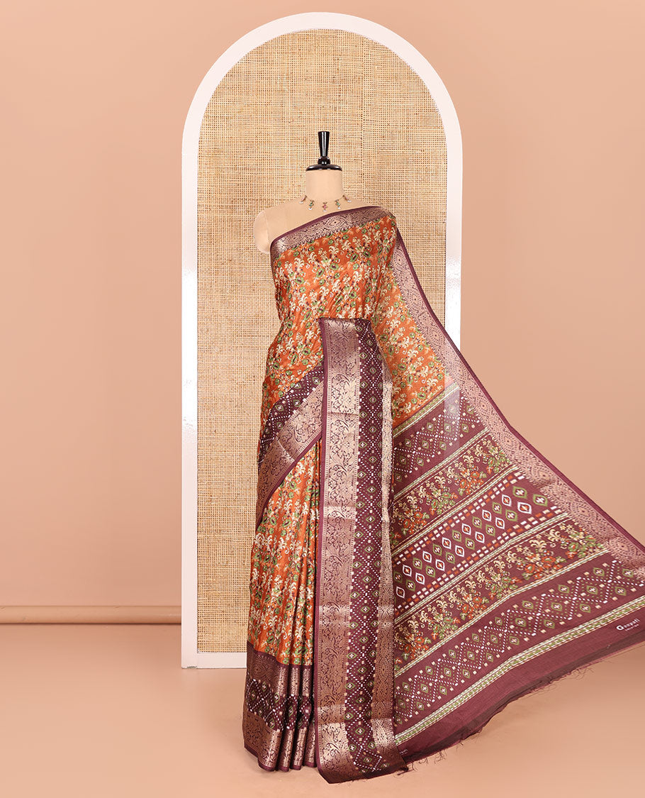 Brown Dola Silk Saree Enlivened with Floral Prints All Over the Body, Complemented by a Contrast Border Featuring Zari and Ikkat Designs, with a Pallu Decked in Ikkat and Floral Prints, Paired with a Contrast Blouse