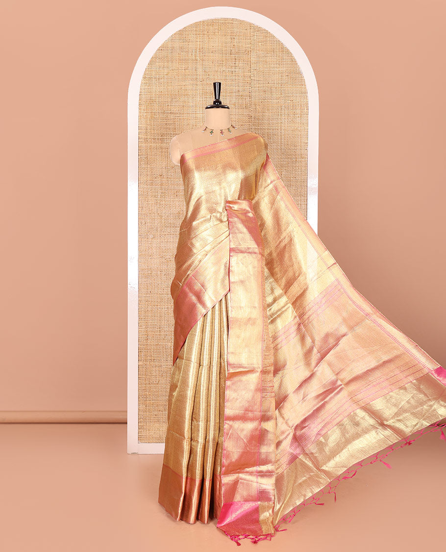 Gold Tissue Saree Features Floral Jacquard Design Woven All Over Its Body, Features a Contrast Gleaming Zari Traditional Design Border, Zari-Enriched Pallu, and a Matching Blouse