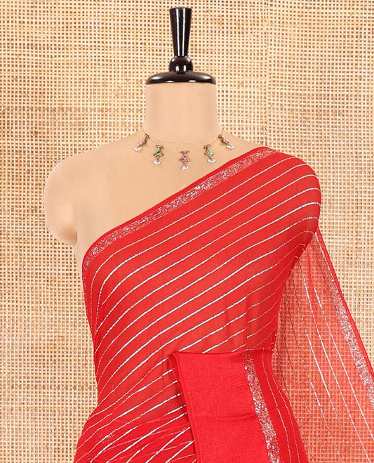Red Viscose Georgette Saree Gleamed with Horizontal Golden Zari Stripes All Over Its Body, Accentuated by a Satin Plain Border, a Self Pallu Featuring the Same Horizontal Stripes, and Paired with a Running Blouse