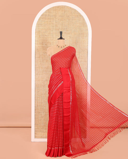 Red Viscose Georgette Saree Gleamed with Horizontal Golden Zari Stripes All Over Its Body, Accentuated by a Satin Plain Border, a Self Pallu Featuring the Same Horizontal Stripes, and Paired with a Running Blouse