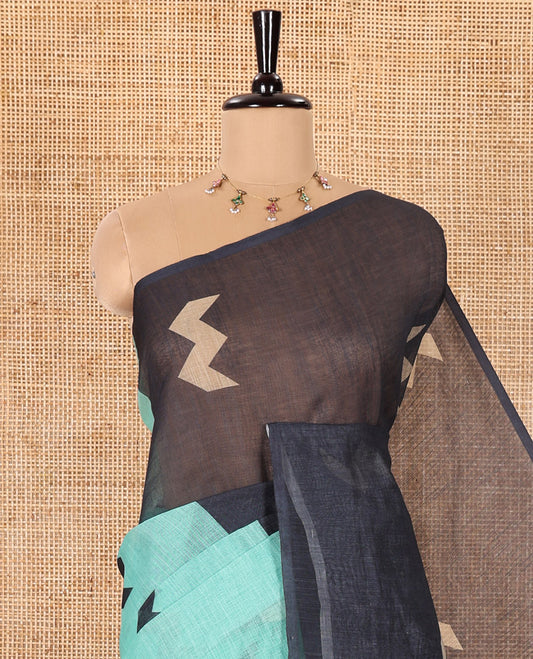 Borderless Green Linen Cotton Saree, Elegantly Printed with Zig-Zag Geometric Motifs, Pallu Mirrors the Same Motifs, and Paired with a Contrast-Printed Blouse