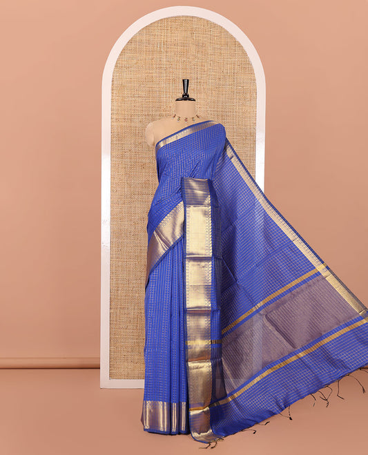 Royal Blue Semi-Katan Silk Saree, Elevated with Golden Zari Checks on Its Body, Highlighted by a Traditional Zari Border of Paisley and Rudraksham Designs, Gleaming Pallu, and Paired with a Matching Blouse